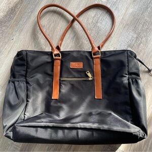 Chic Black Tote Bag with Brown Straps